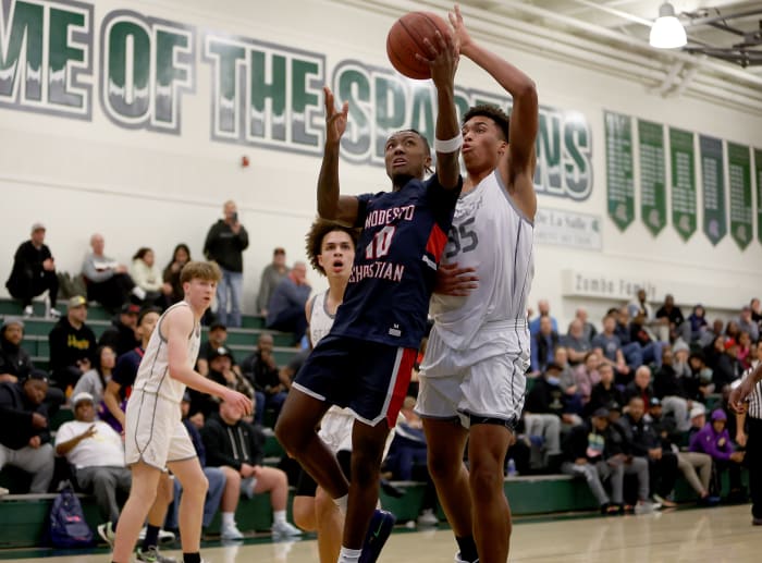 Caedin Hamilton (35) with a block from behind for St. Joseph in 2023.